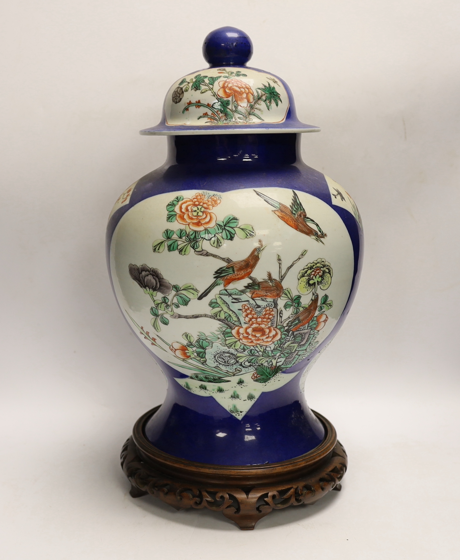 A Chinese powder blue vase and cover, Guanxu period, on wooden stand, 44cm